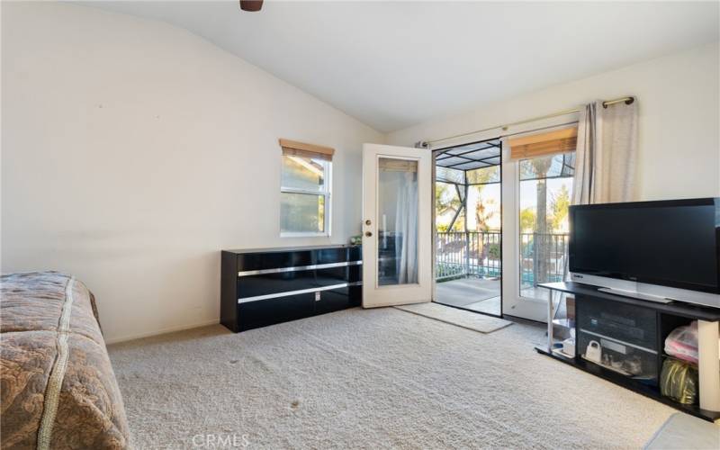 Primary leads to a large balcony that can be used as as Sun room