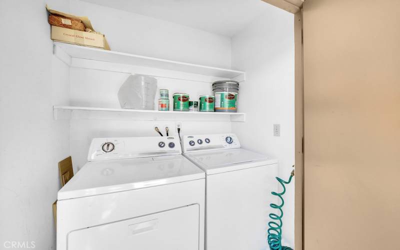 Washer and dryer located on the patio.