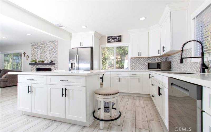 Quartz Kitchen Counters and Self Close Drawers and Cabenits