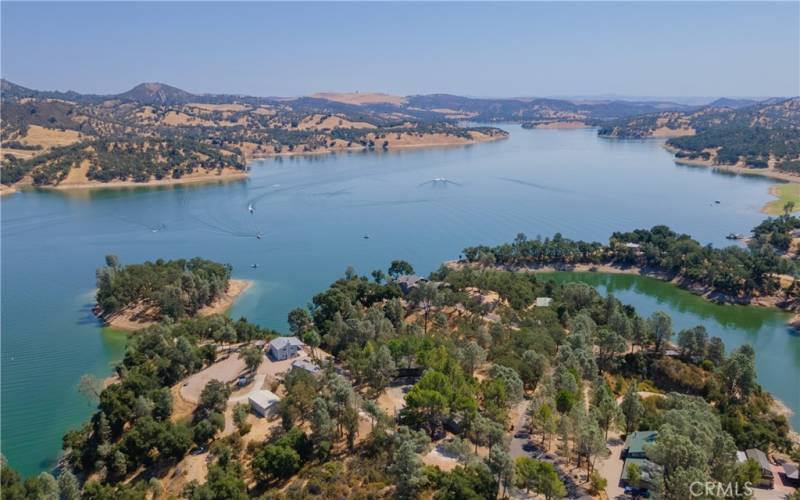 Aerial of house (in trees) & cove