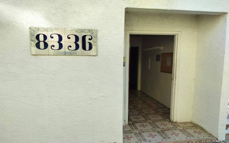 Community bathroom and court near pool and spa area.