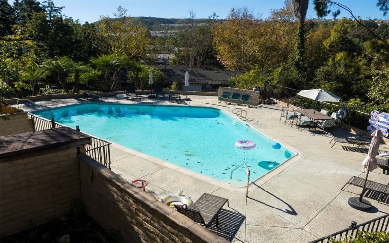 View of community pool from bedroom balcony