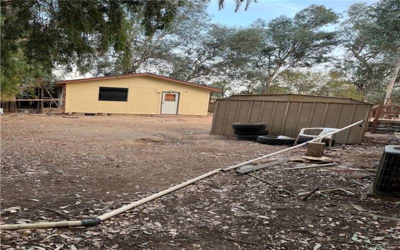 18100 HONEY LANE PARTIAL VIEW OF BACKYARD WITH SHED