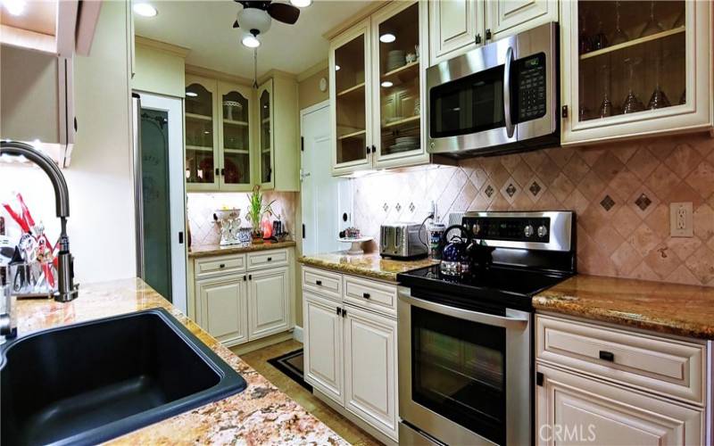 Partial view of kitchen showing pantry.