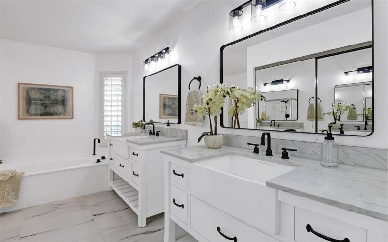 Primary bathroom with double vanities.