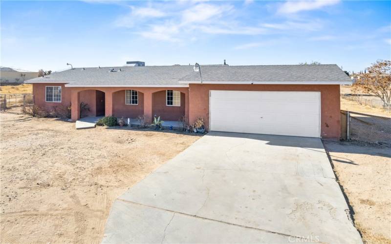 Front garage w/concrete driveway