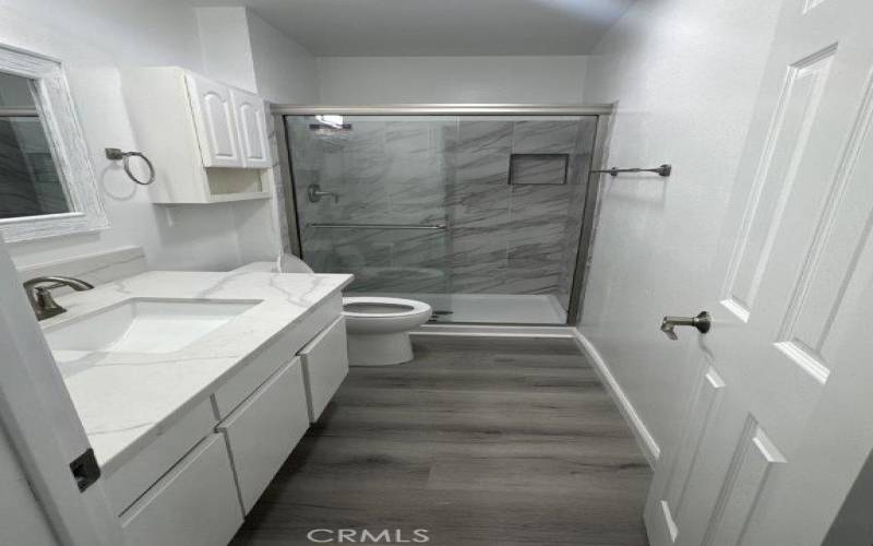 2nd Bathroom with tiled shower, faux Granite countertops