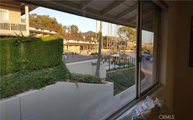 VIEW FROM GUEST BEDROOM LOOKING AT UPPER COMMUNITY POOL AREA