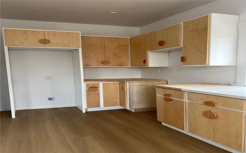 Kitchen with stairs to basement and walk-in pantry