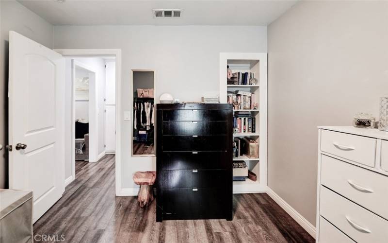 Second bedroom with built-in bookcase