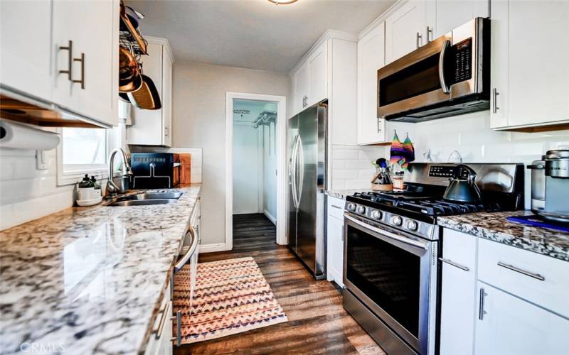 Kitchen with granite countertops and stainless steel appliances