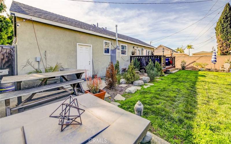 Large Backyard looking at garage wall