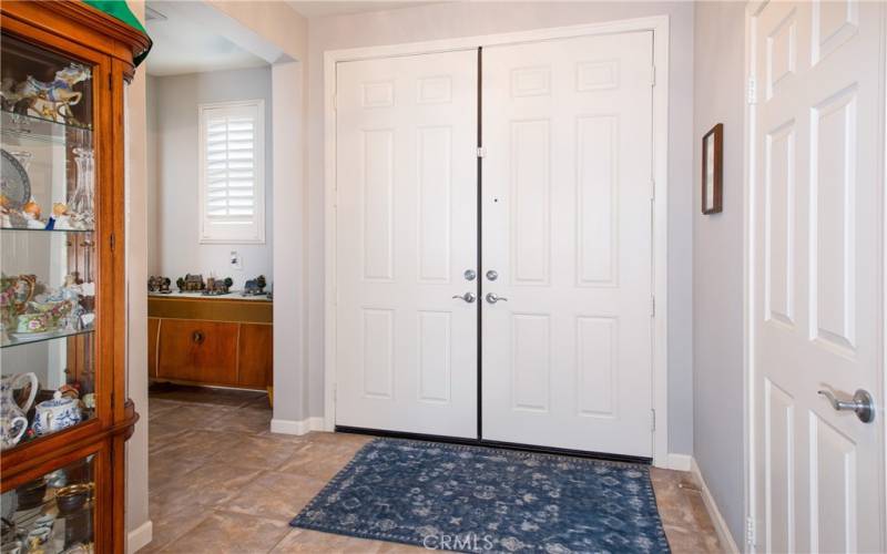 Double door entry onto tile floors.