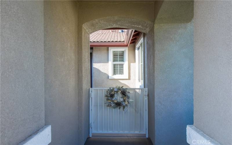 Gated to front courtyard.