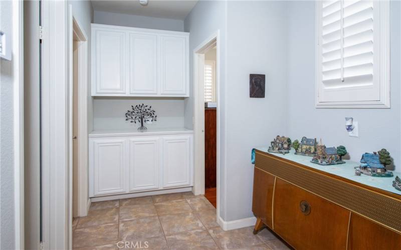 Hall with tile floors leading to the guest bedrooms.