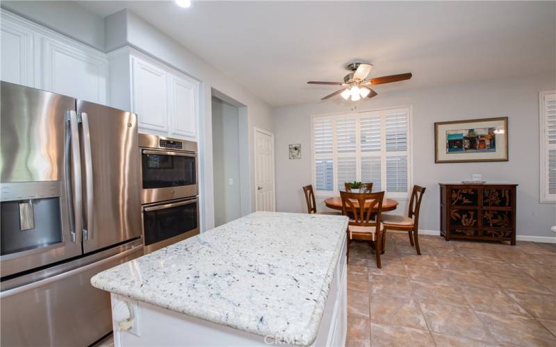 Kitchen looking towards the dinette and step in pantry.