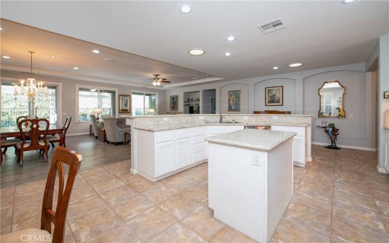 Kitchen island and breakfast bar that can accommodate up to eight stools.