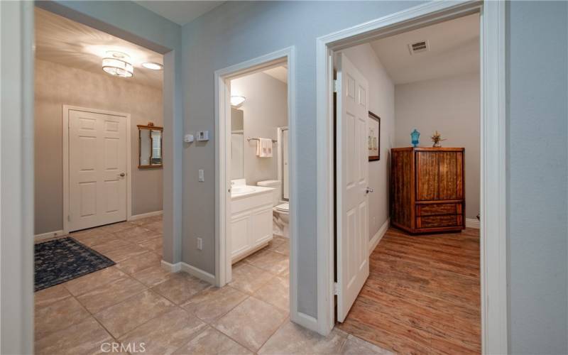 Hall bath and adjoining guest bedroom entries.