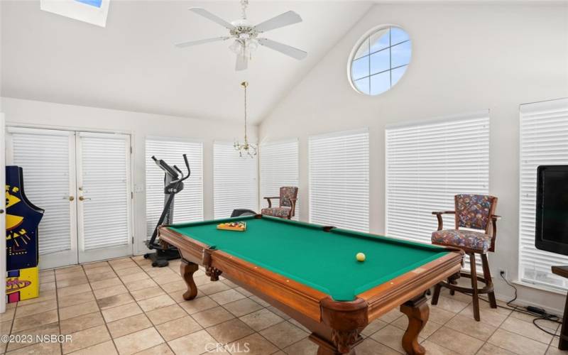 Sunroom with a circle window that captures the moon at times.