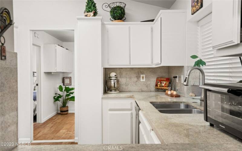 Granite countertops and stainless steel sink.