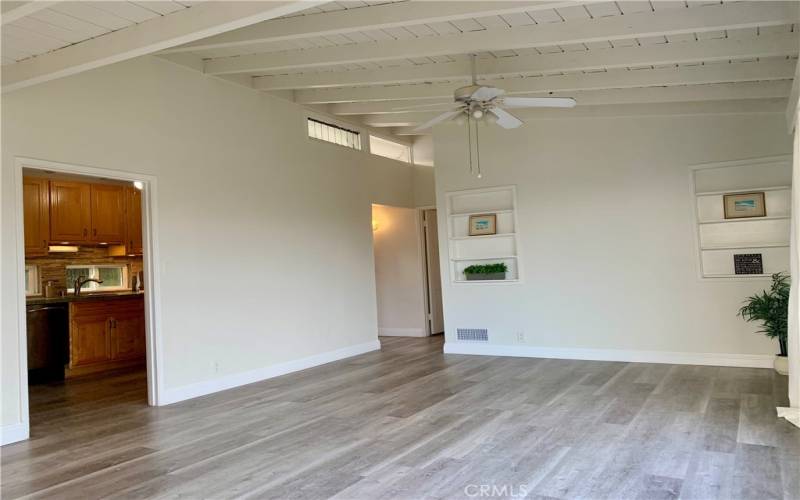 High ceilings in living room, built in bookcases.