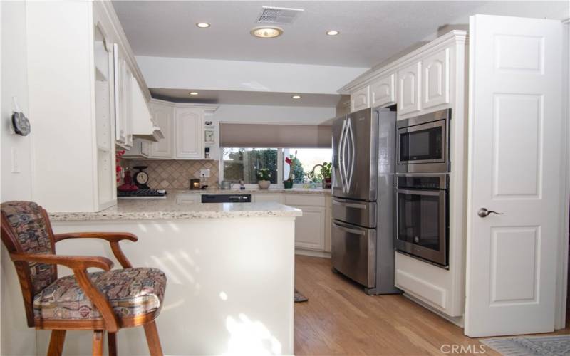 Kitchen bar / granite countertops and stainless appliances