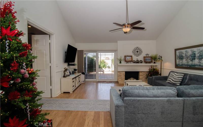 View into living room. Slider door to backyard covered patio