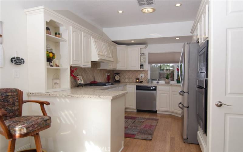 Kitchen bar / granite countertops and stainless appliances