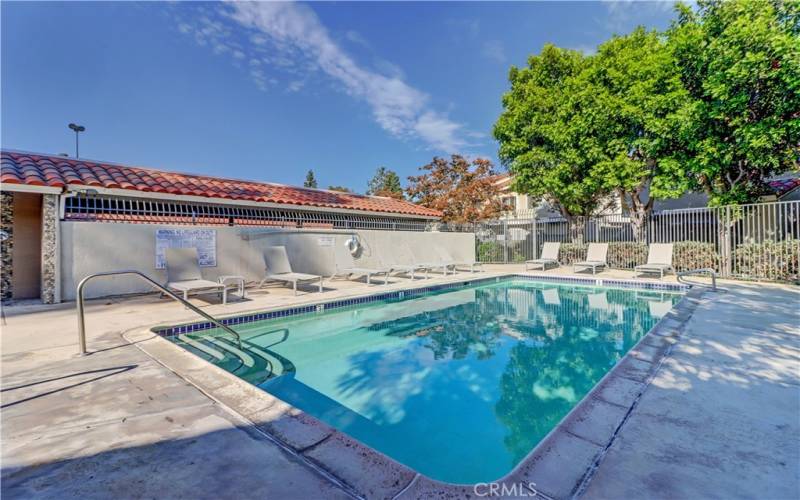 Bathrooms are to the left of the picture of the pool.