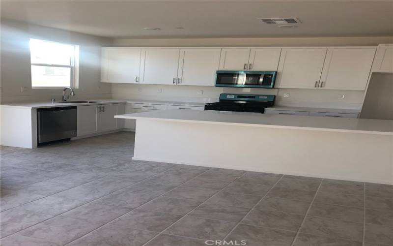 Large Kitchen Island with quartz Countertops

Tile flooring downstairs