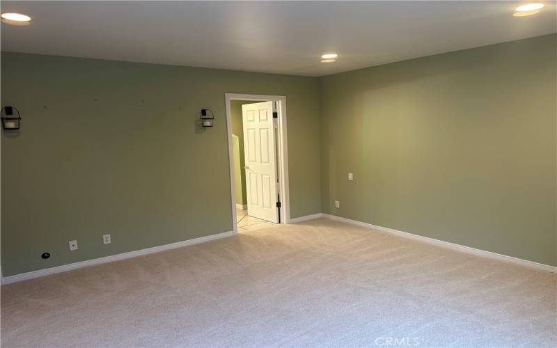 Primary bedroom bath entry in foreground