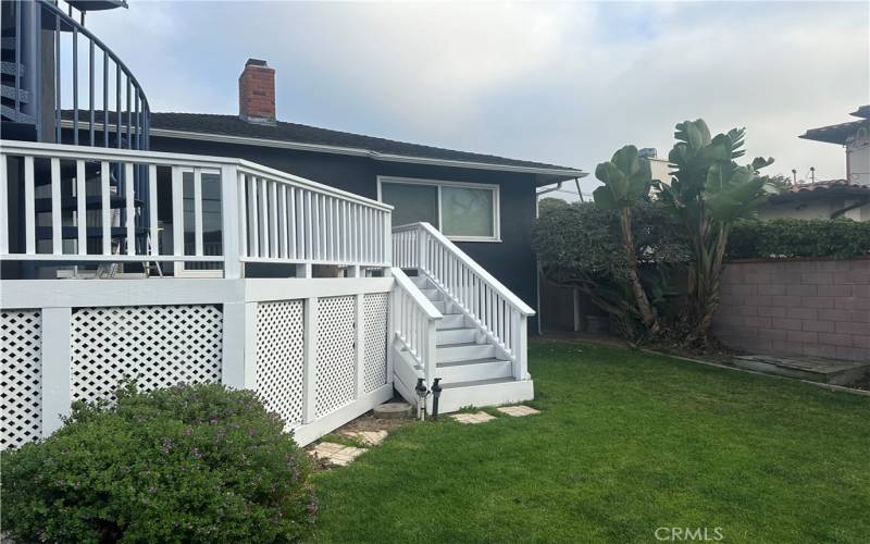 Rear yard with access to deck off of living room