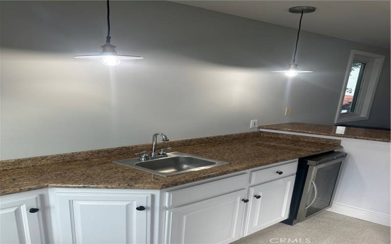 Family room wet bar with fridge