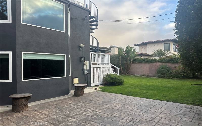 Patio, plus a grassy area and deck access