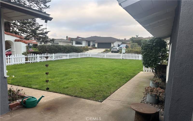 Large fenced, front yard.