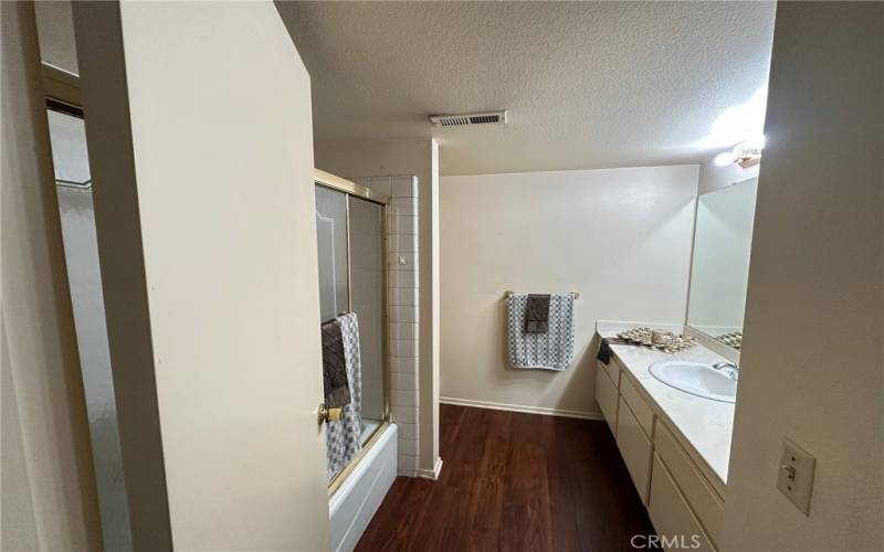 Hallway Bath (tub with glass sliding doors)