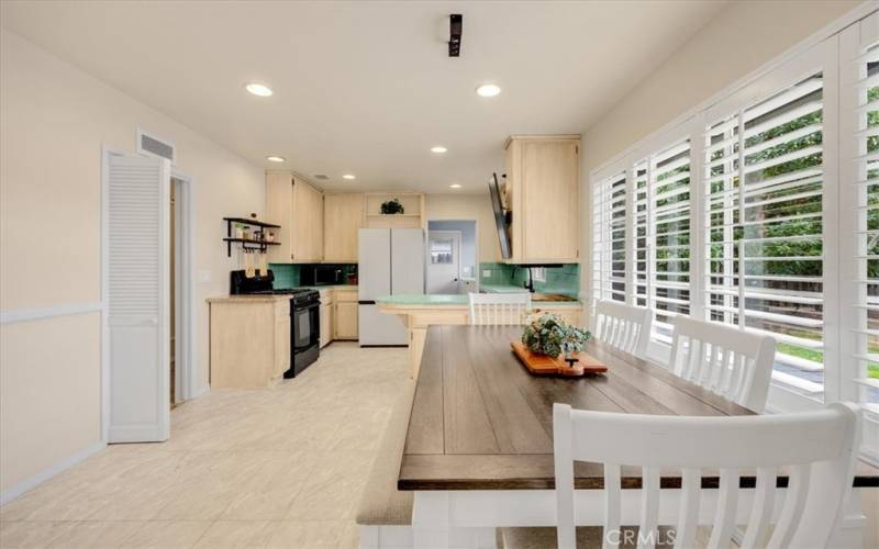 Nice open dining area, plenty of space outside to push this wall out when your family grows.