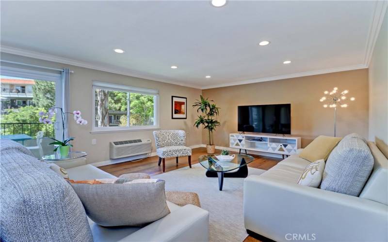 Living Room; Crown Molding Recessed Lights, Smooth Ceiling, Double Pane Windows & Sliding Glass Door to Balcony