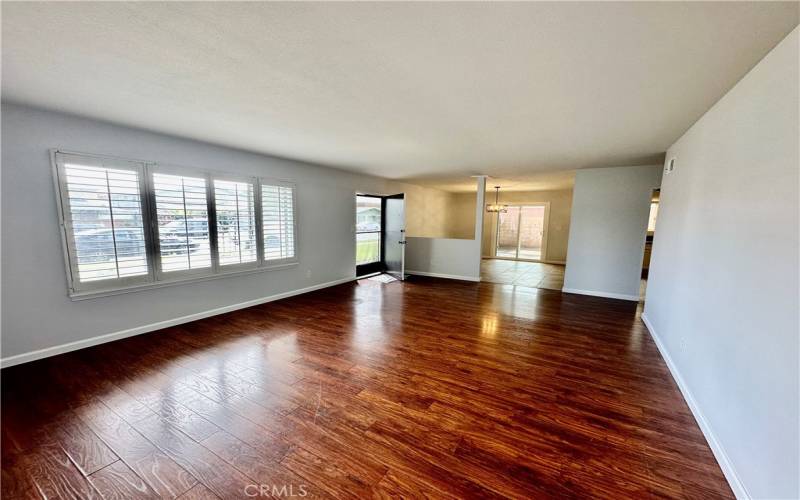 Living room connects with dining space and kitchen