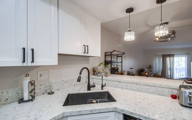 Very nice sink area and counter top space