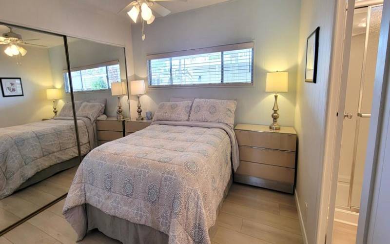 GUEST BEDROOM WITH MIRRORED CLOSET