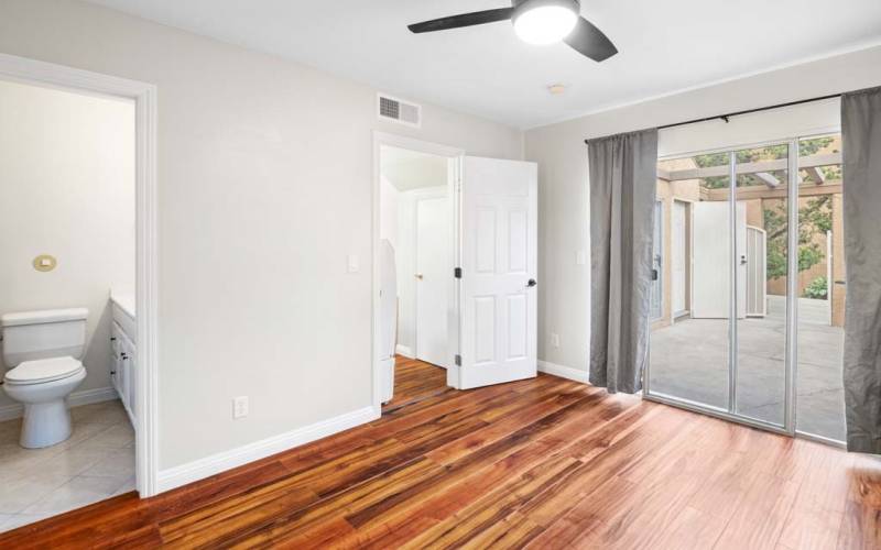 Down stairs Bedroom with View leading to Patio