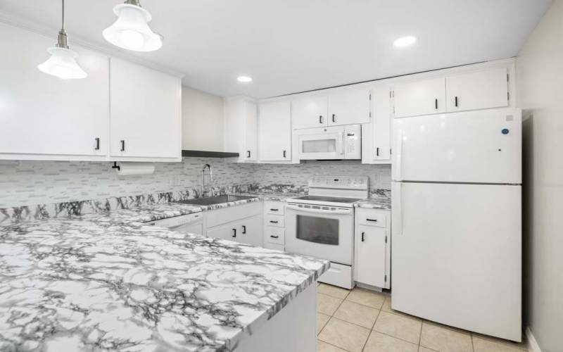 Kitchen view with Refrigerator Included