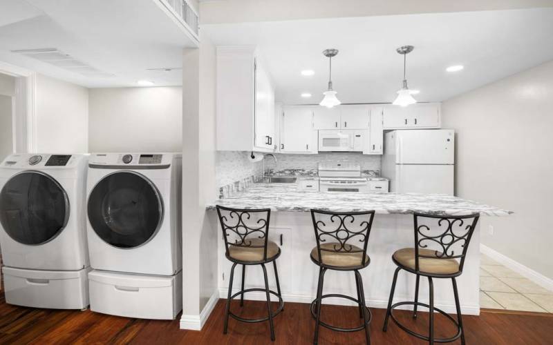 Kitchen with washer and dryer included