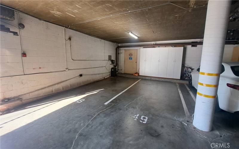 side by side parking spaces & storage closets