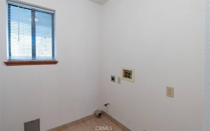 Adjacent to the pantry is the laundry room.