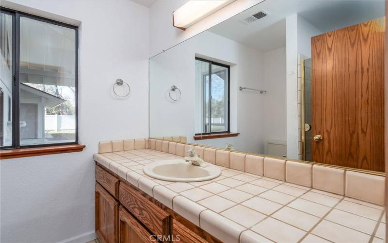 The primary bathroom features a tiled shower.