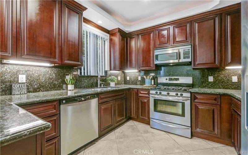 Spacious kitchen with ample cabinets & counter space and stainless steel appliances.