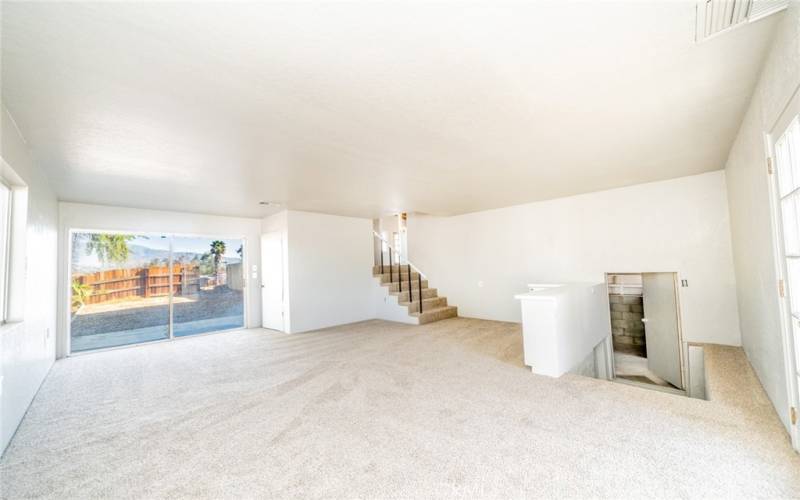 Great room downstairs from master bedroom with view of cellar