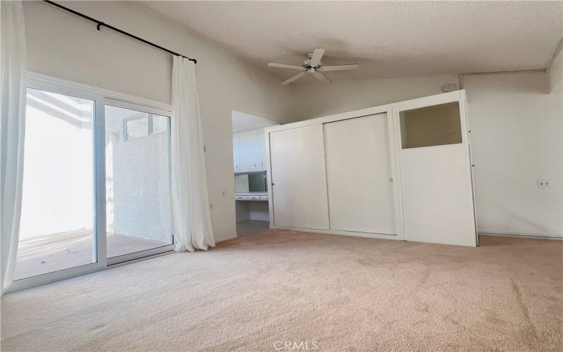 Upstairs bedroom loft with an exterior deck.